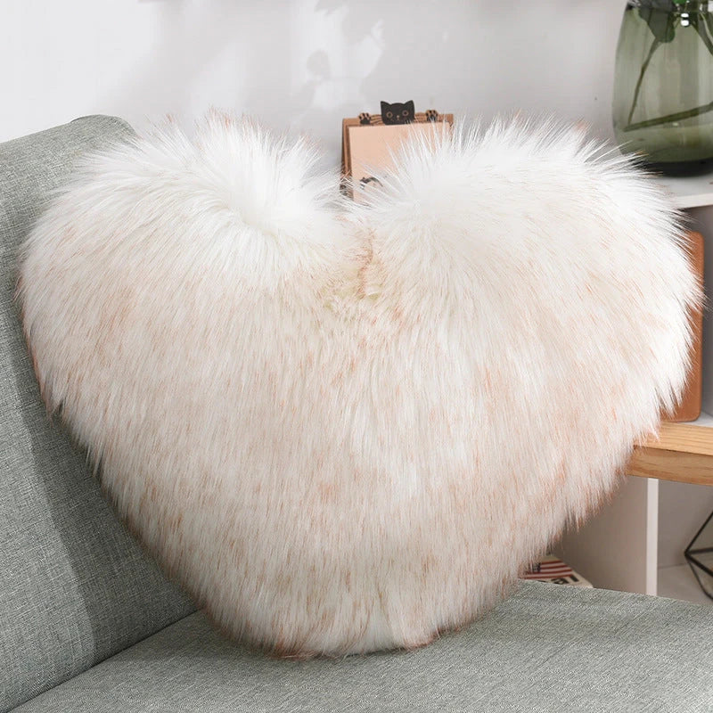 Cozy heart-shaped plush throw pillows in various colors and sizes for living room and bedroom decor