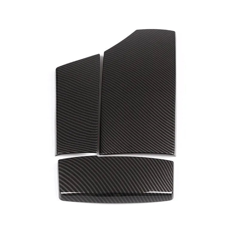 Set of three black ABS plastic armrest box covers with a shiny carbon fibre weave pattern.