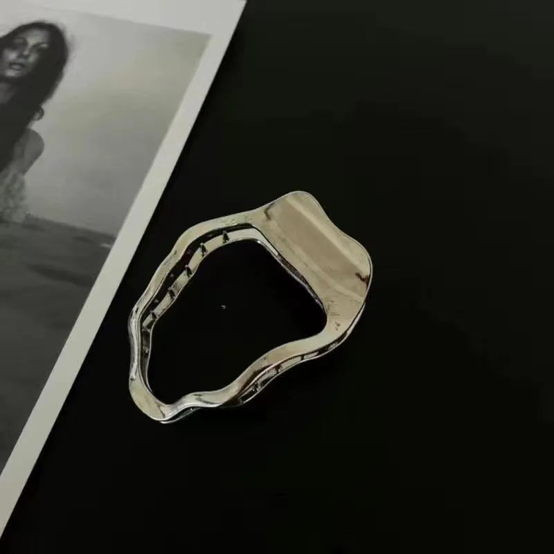 Women's gold and silver zinc alloy hair barrettes in arc, square, and triangle shapes.