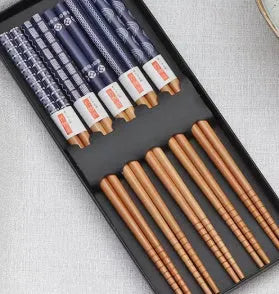 Set of five pairs of bamboo chopsticks showing lucky cat and chi ya blue pattern designs in gift box.