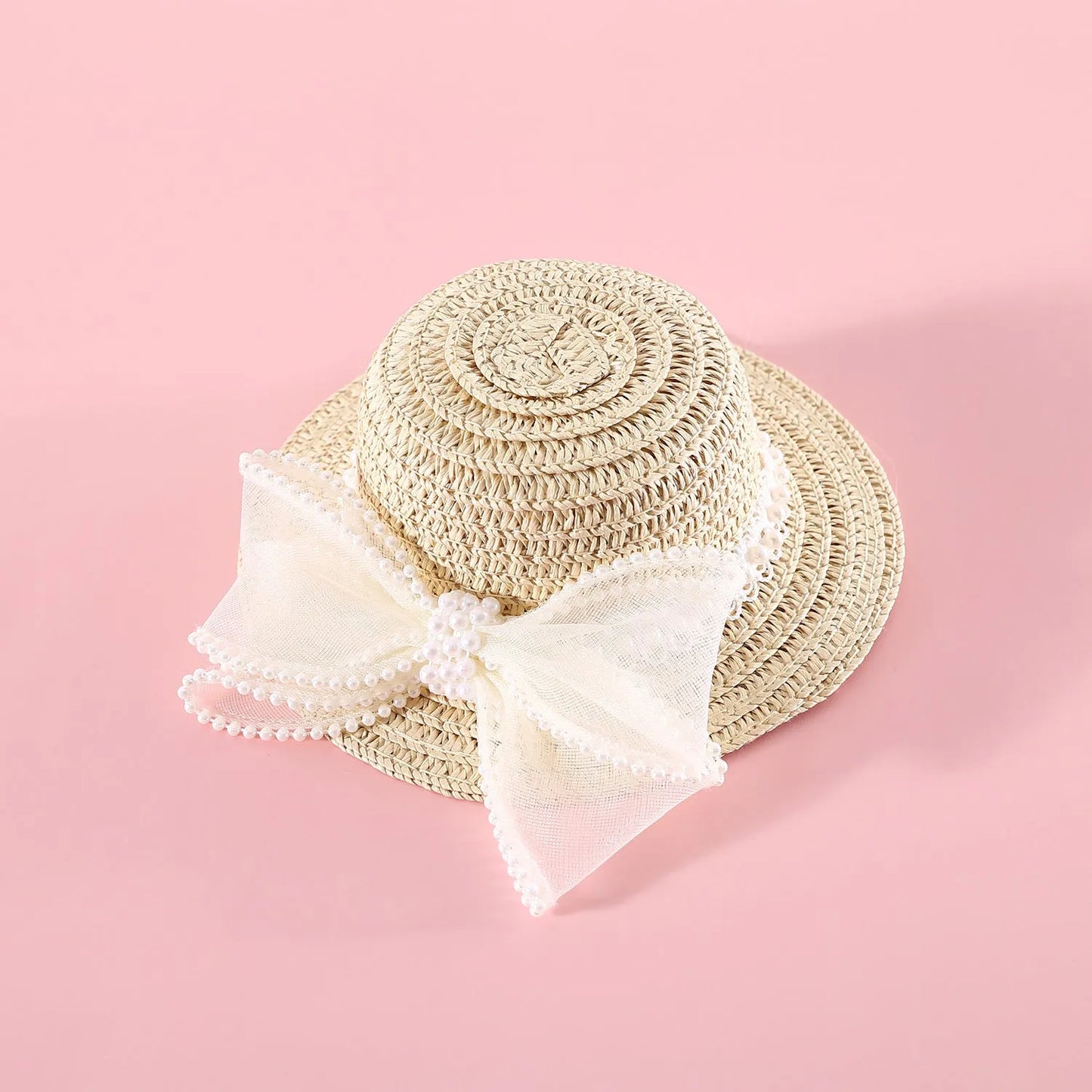 A woven Lafite leaf hat for cats with a pearl butterfly bow, shown in pink, purple, blue, and white colour options.