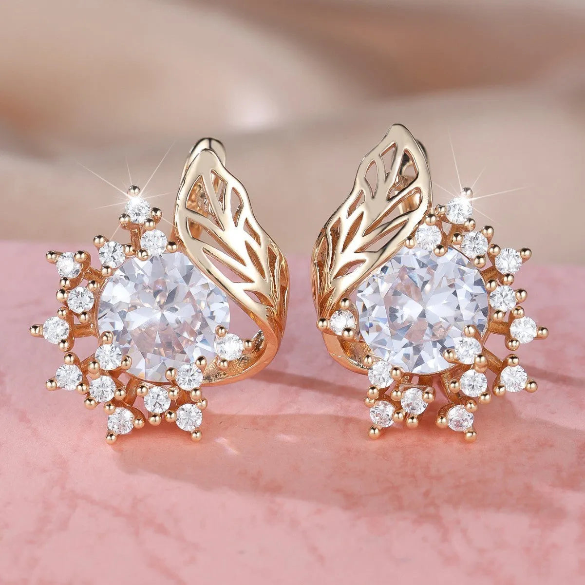 Round flower and feather design earrings in champagne gold with a choice of coloured zircon stones.