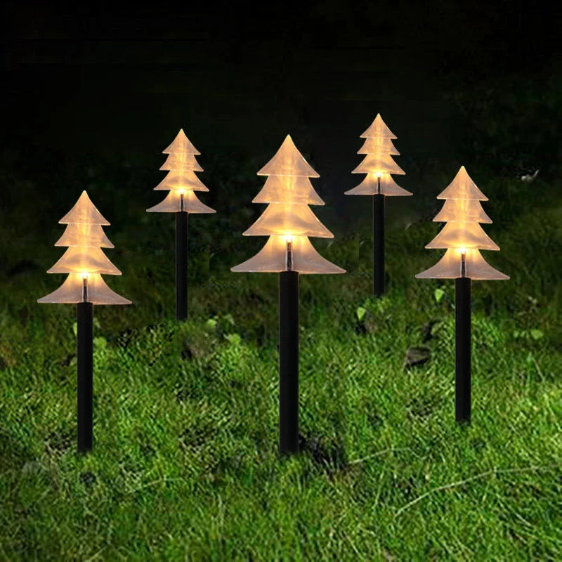 Snowflake-shaped garden lights with warm, soft glow illuminating an outdoor garden or patio area