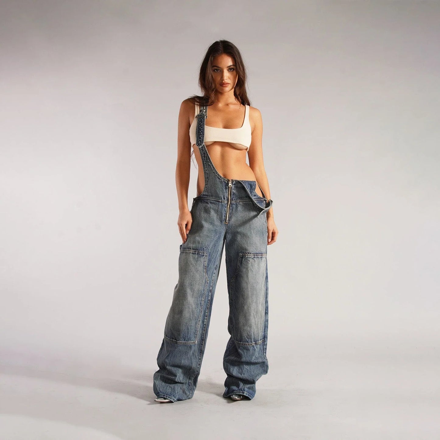 Fashionable Y2K-inspired denim overalls with pockets, suspenders, and a loose, comfortable fit