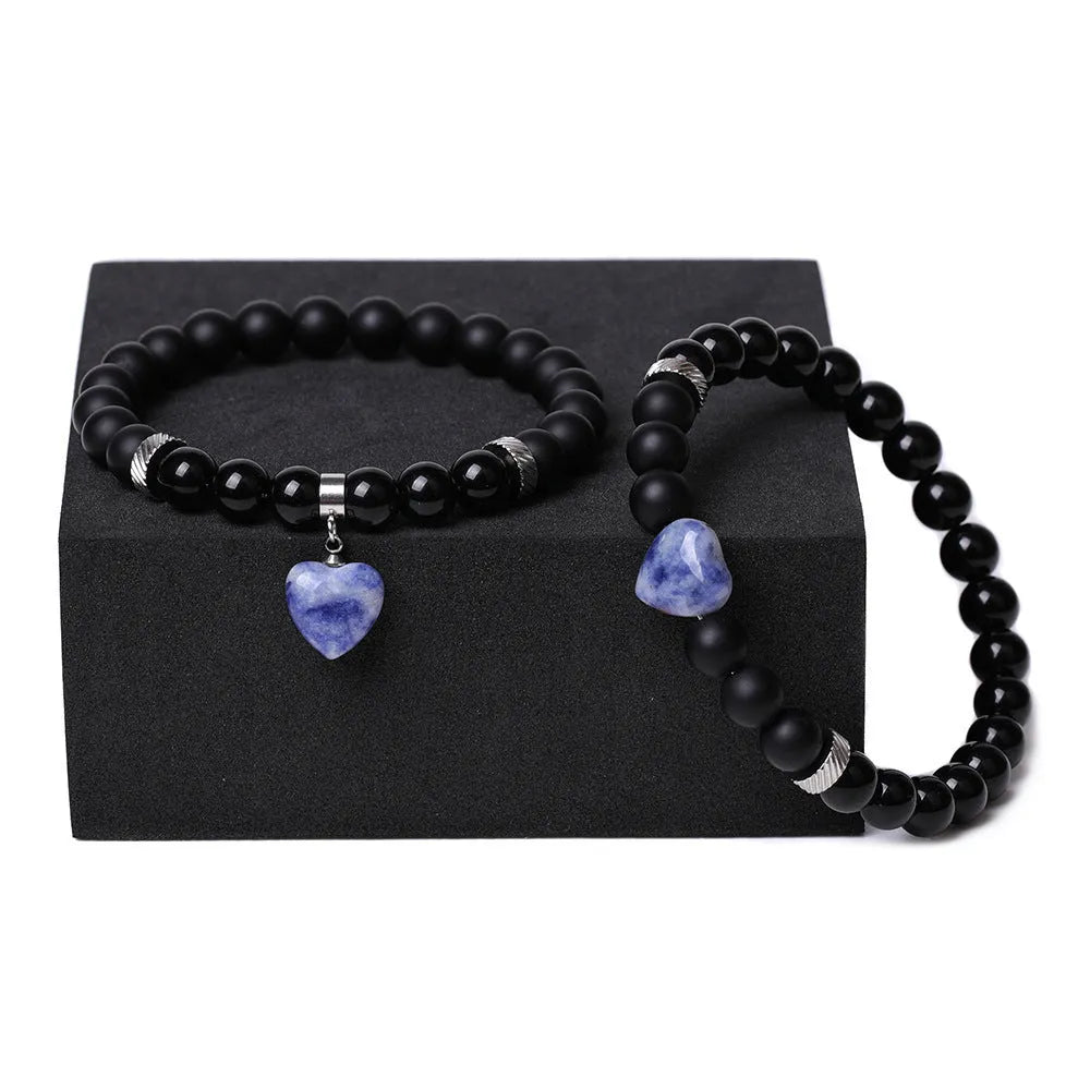 Matching couple bracelets with polished natural stone heart pendants in geometric style