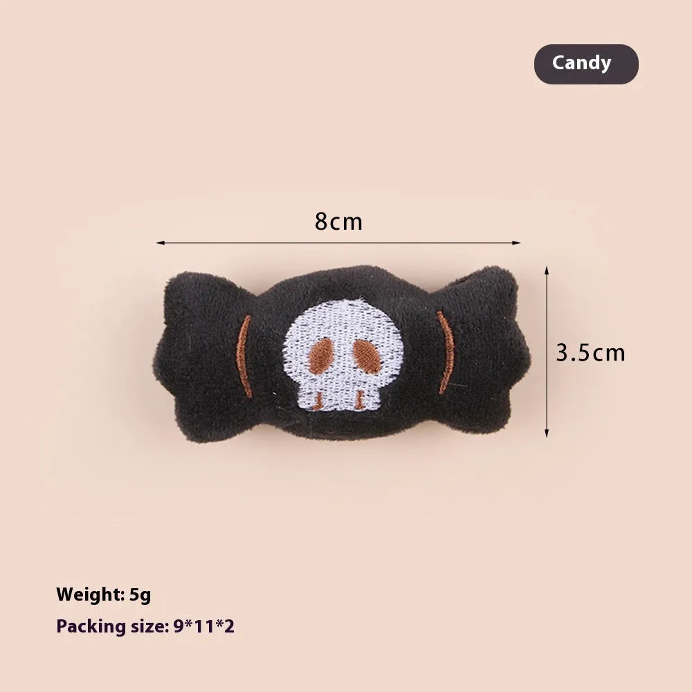 Plush cat teaser wand with candy, eyes, and skull heads on a 40cm string next to a wand handle.