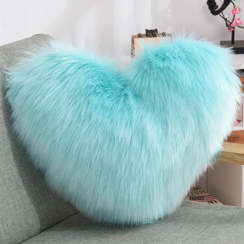 Cozy heart-shaped plush throw pillows in various colors and sizes for living room and bedroom decor