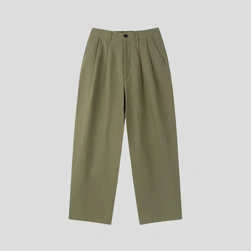 Men's apricot cotton linen trousers with elastic waistband and pencil leg opening on hanger
