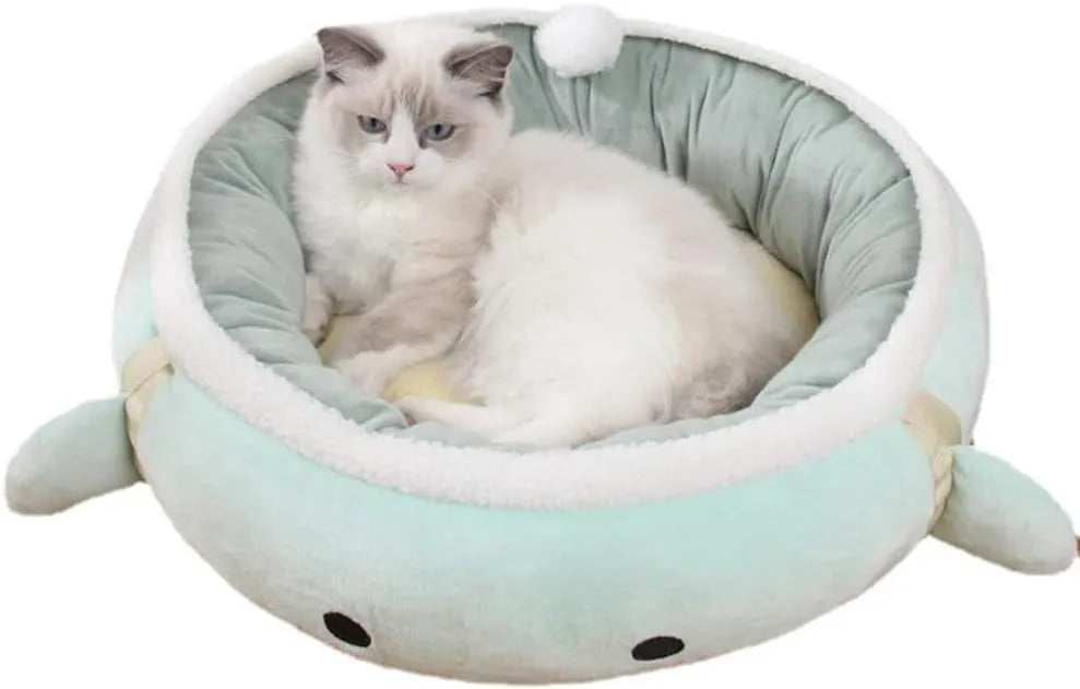 Green chick-shaped cat bed laid flat with hanging straps attached, suitable for small cats