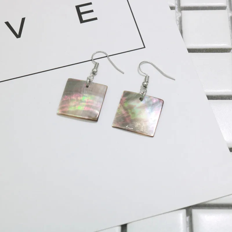 Natural shell earrings in geometric square and rectangular shapes with panther pattern detailing