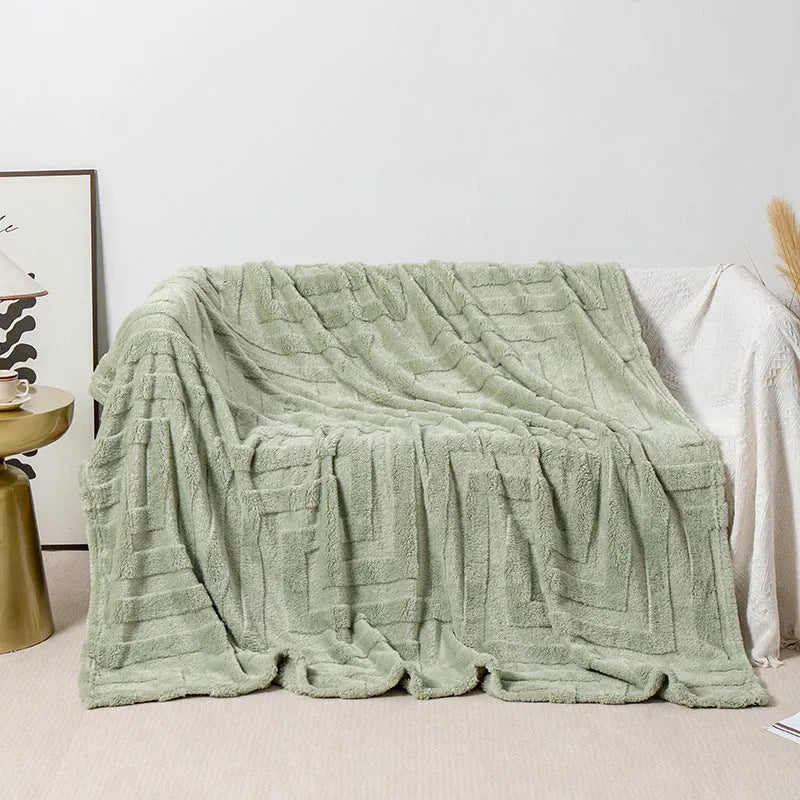 Thick square coral fleece blanket in a modern style, shown in one of five colours including lake blue or khaki.