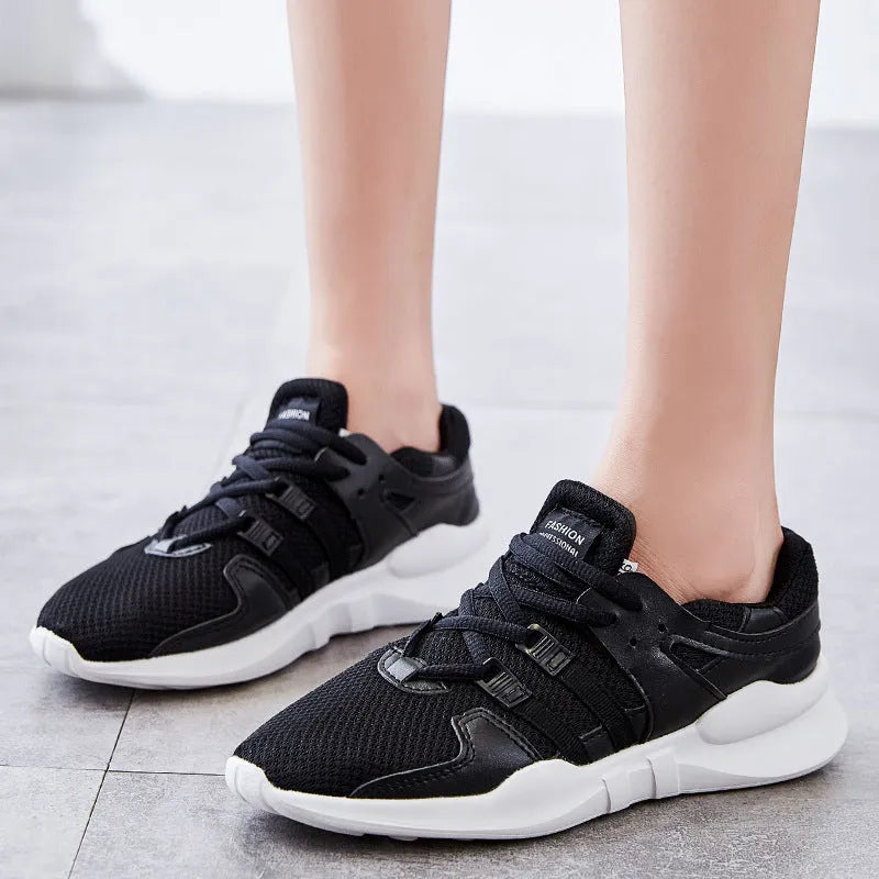 Low-top casual sneaker in mesh with hollow-out design and round toe.
