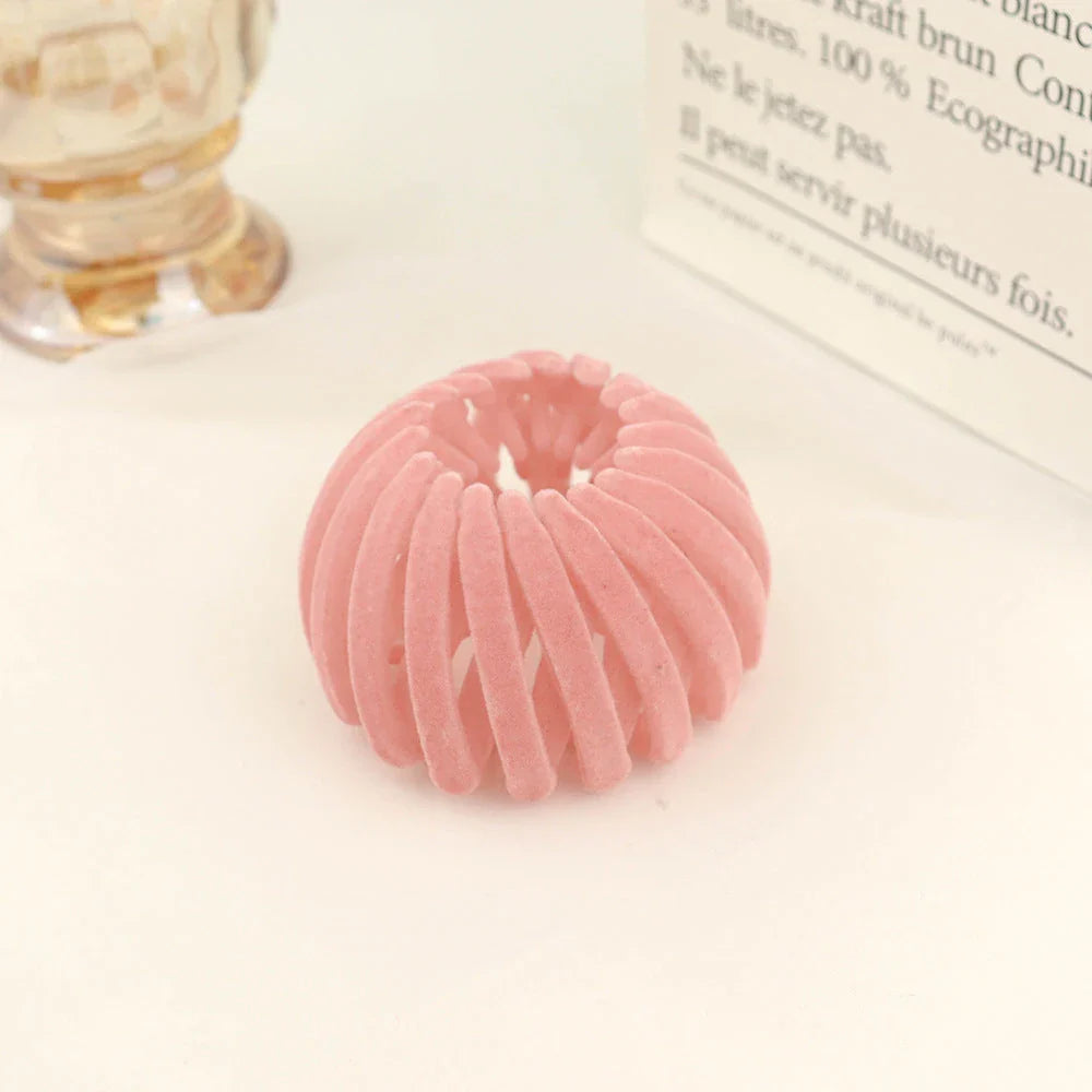 Adjustable ponytail hair accessory with flexible teeth, available in various colors, designed for easy, natural-looking hairstyles