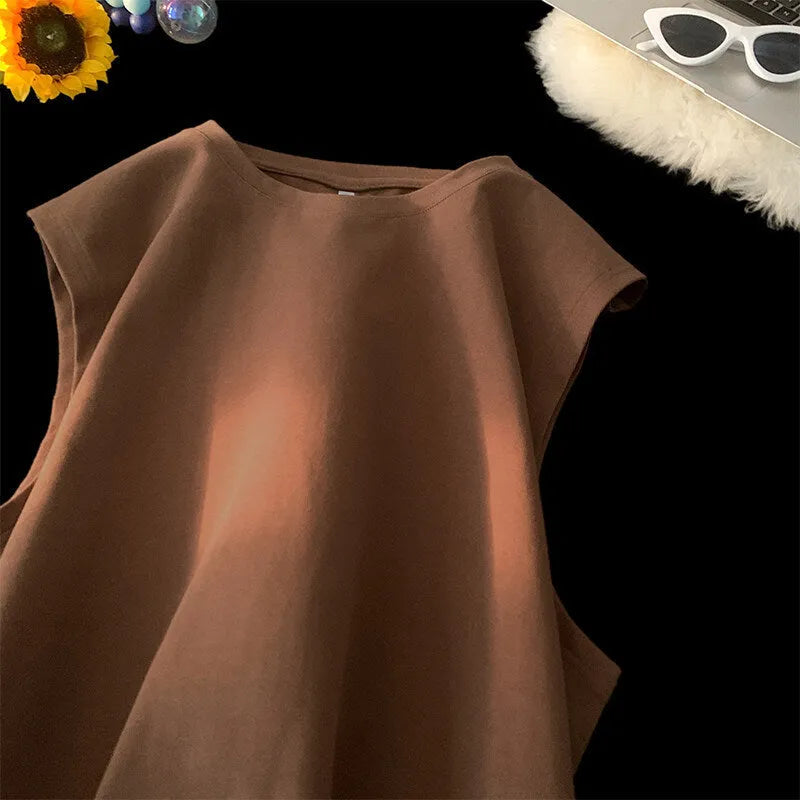 Men's loose solid colour cotton sleeveless tank top on a hanger.