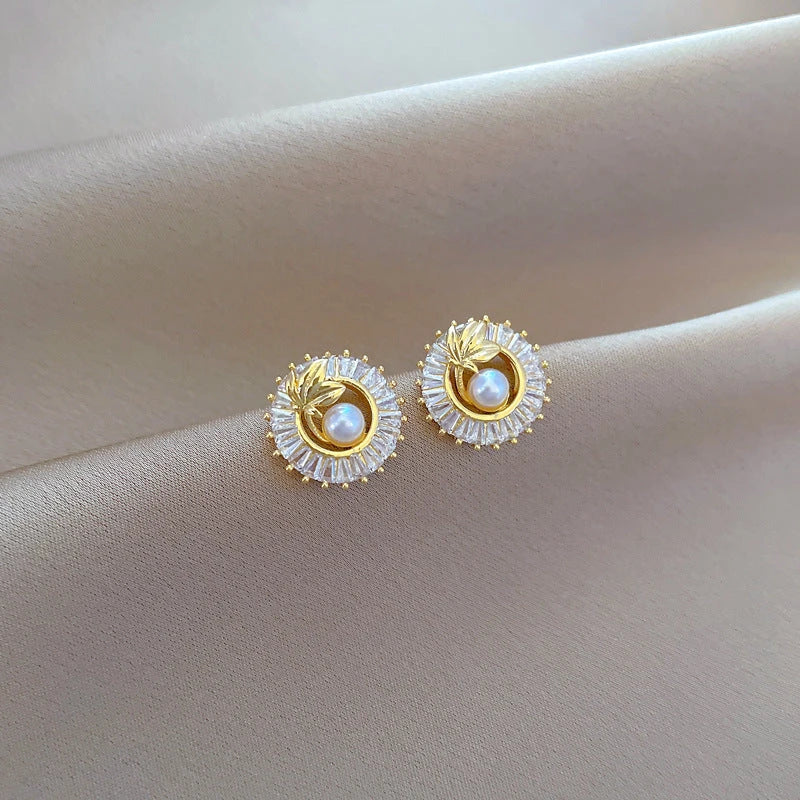Geometric crystal jewelry set including necklace, earrings, and ring with square-shaped design and sparkling crystals