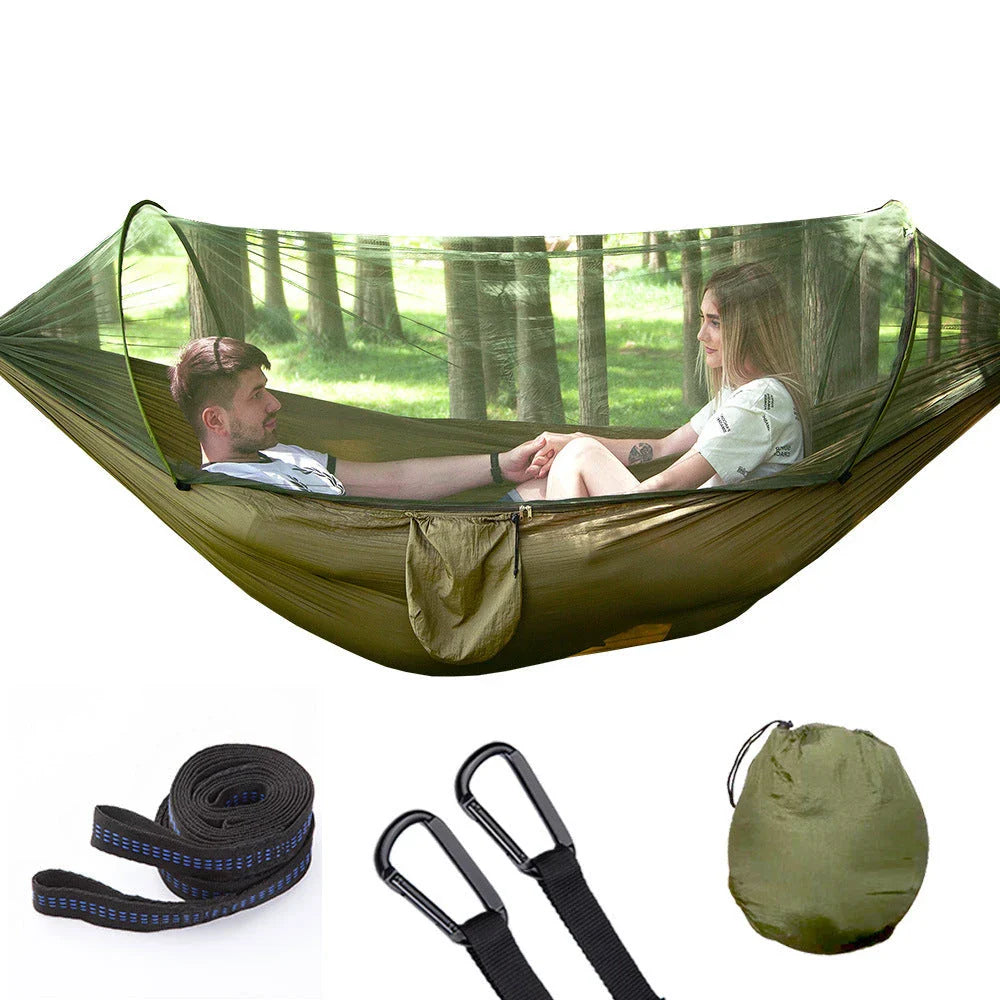 Cozy outdoor hammock with mosquito net for relaxing in nature and outdoor adventures