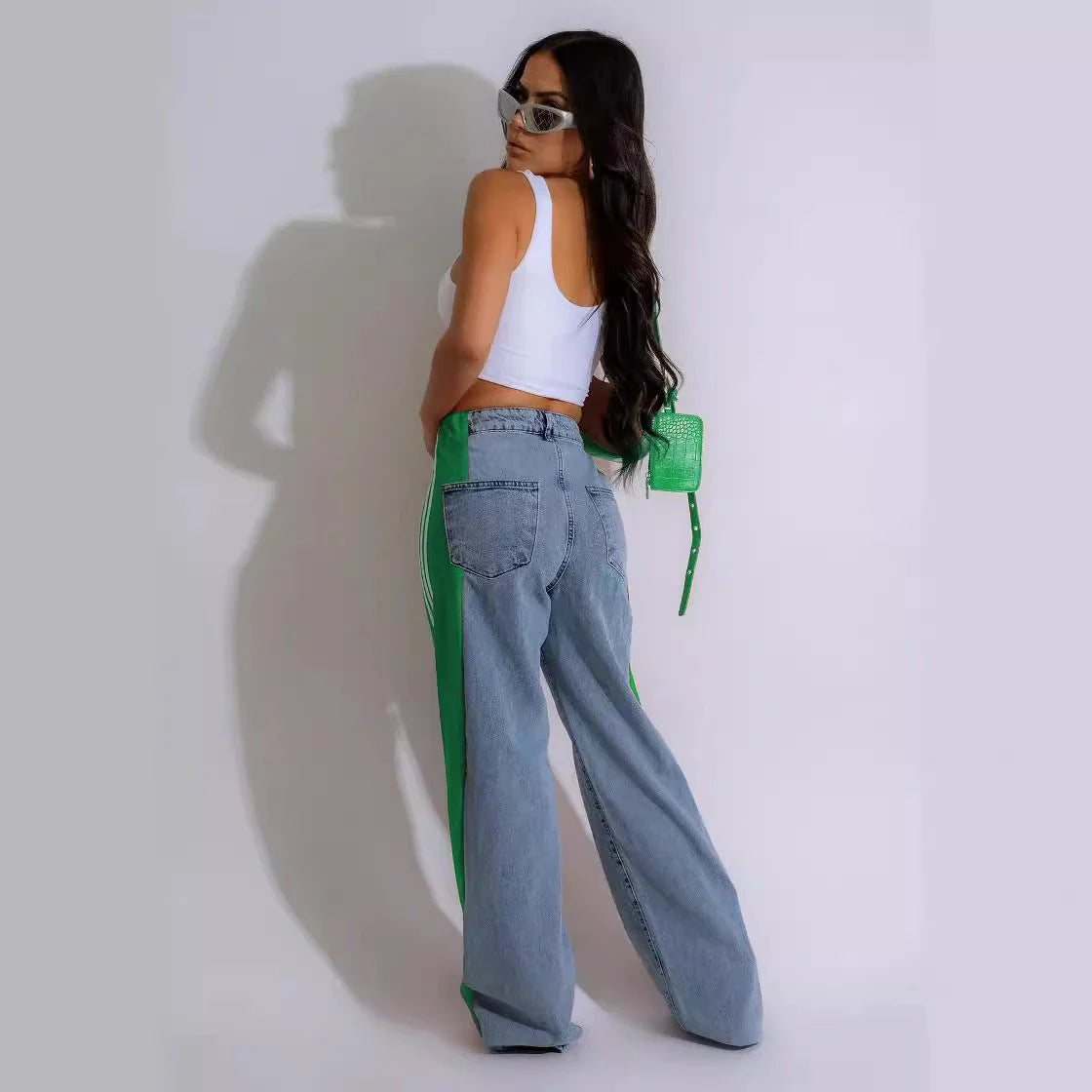 Stylish high-waist denim trousers with patchwork design, available in various color options