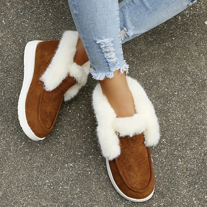 Premium warm winter snow boots for women featuring a stylish suede upper, plush lining, and durable sole for cold weather protection.
