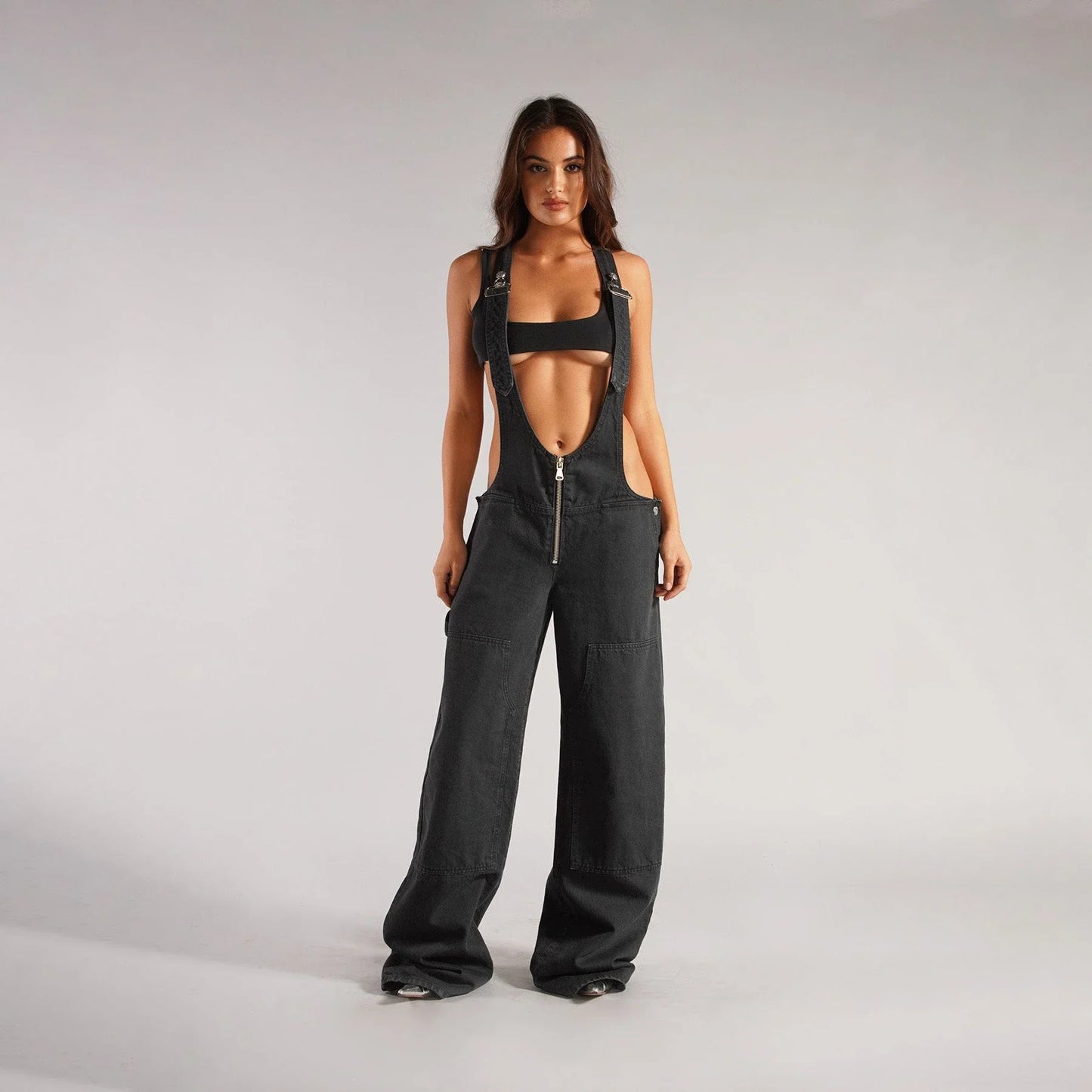 Fashionable Y2K-inspired denim overalls with pockets, suspenders, and a loose, comfortable fit
