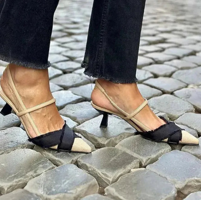 Apricot and black colour-block women's stiletto sandals with a buckle and pointed toe.