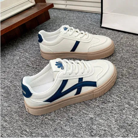 Blue and brown low-top casual sports shoes with round toe and flat rubber sole.