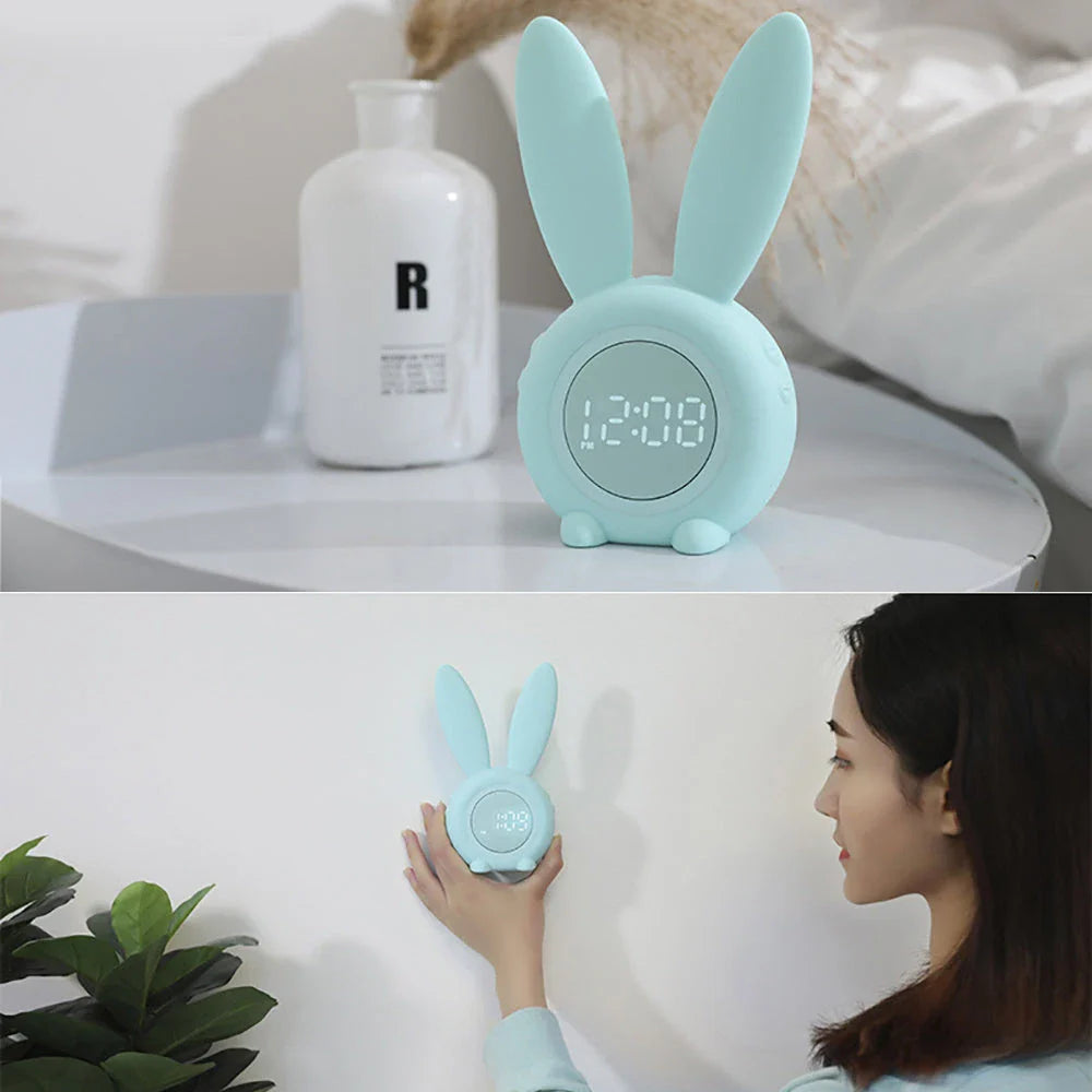 Adorable bunny-eared LED alarm clock with sound control, available in blue, green, and pink colors