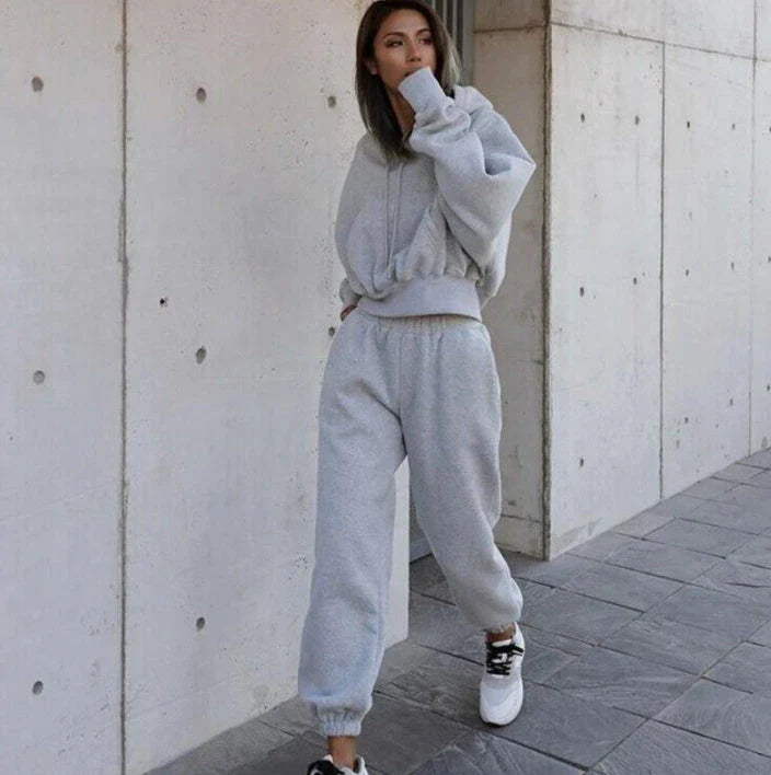 Women's casual hoodie outfit in various colors and sizes, featuring a stylish design and comfortable polyester construction.