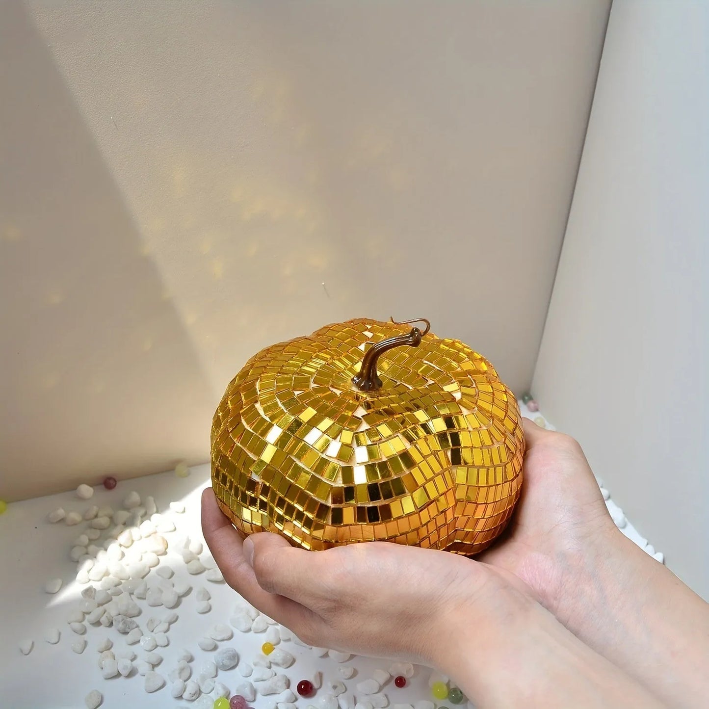 A Chinese-style embroidered glass pumpkin Halloween decoration in various sizes.