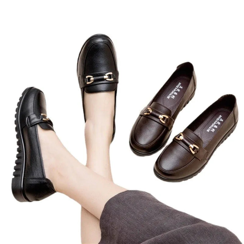 Black women's casual leather pumps with a round toe, low flat heel, and soft rubber sole.