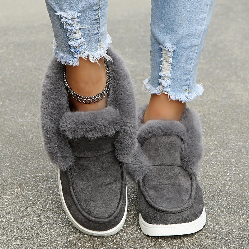 Premium warm winter snow boots for women featuring a stylish suede upper, plush lining, and durable sole for cold weather protection.