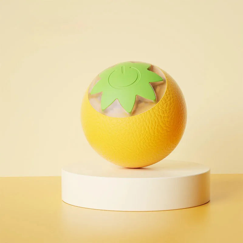 Green automatic rotating ball pet toy for dogs and cats on indoor flooring
