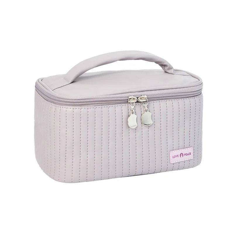 Open-top cake makeup bag in six colour options with PU leather construction and 20cm dimensions