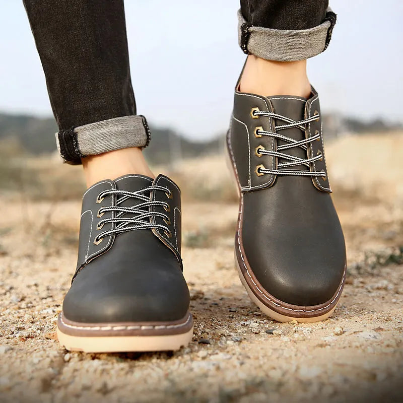 Men's black mid-top boots with waterproof PU upper and non-slip rubber soles