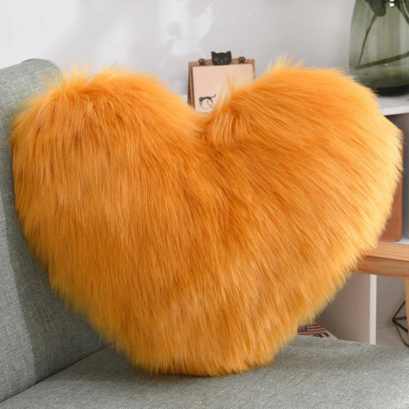Cozy heart-shaped plush throw pillows in various colors and sizes for living room and bedroom decor