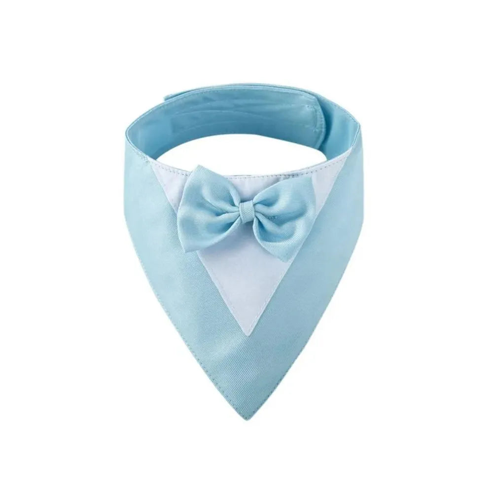 Triangle-shaped pet bib scarf with a bow, shown in a bright colour, displaying the soft fabric and absorbent towelling lining.