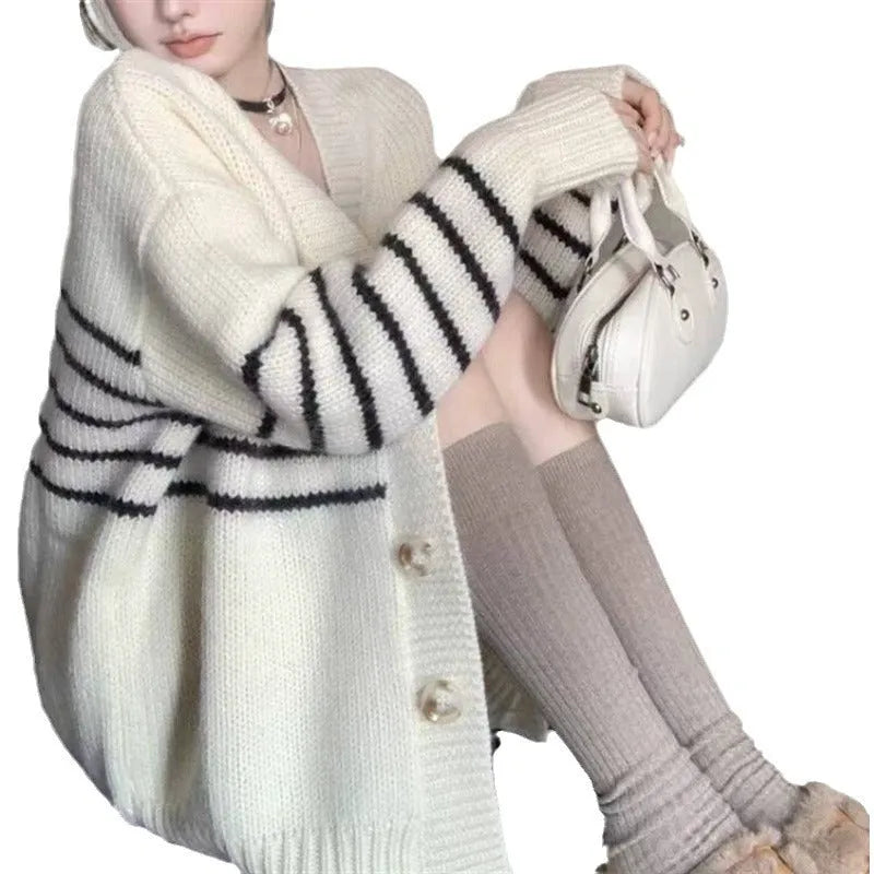 Collar button cardigan with 3D knit texture in a neutral colour, shown with full button front and regular sleeves.