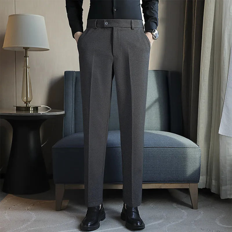 Straight-leg brown corduroy trousers with elastic waistband and slim fit design