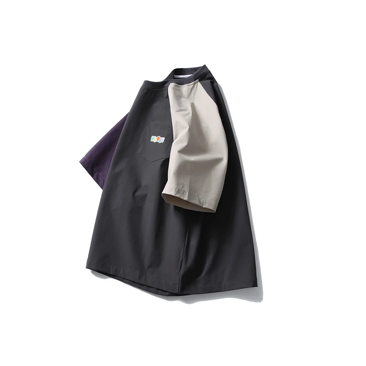 Dark grey loose fit men's t-shirt with contrast colour raglan sleeves on a hanger.