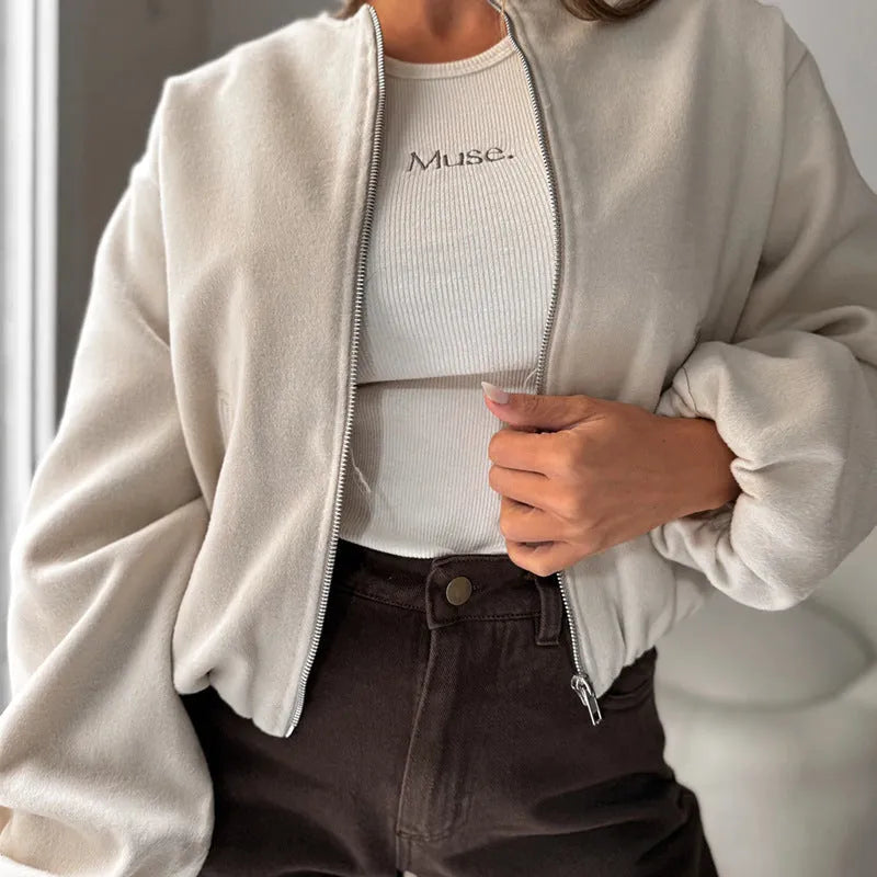 Brown women's off-shoulder short coat with lantern sleeves and pockets on a hanger.
