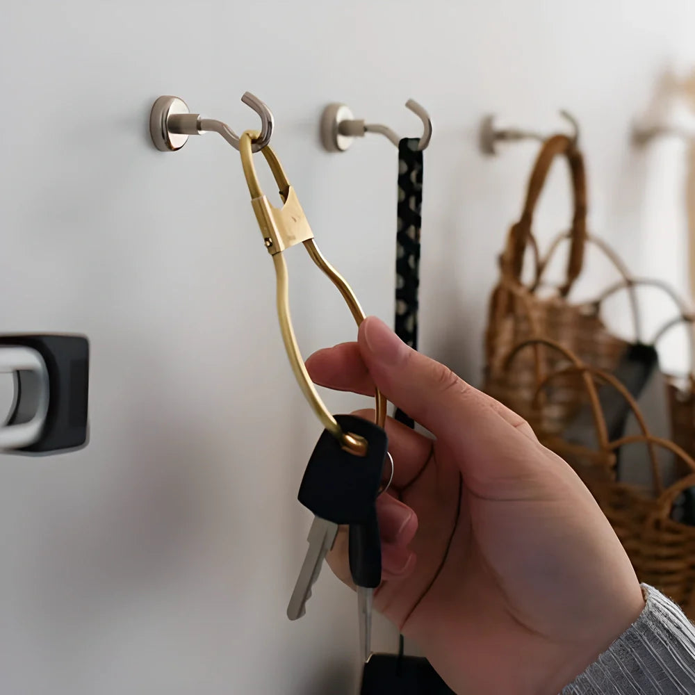 Sturdy magnetic hooks in black and silver colors, capable of holding up to 3kg of weight on any magnetic surface.