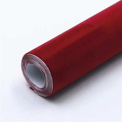 Rolls of self-adhesive leather suede in multiple colours showing texture and adhesive backing.