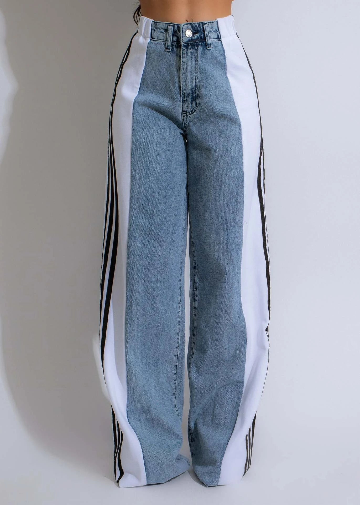 Stylish high-waist denim trousers with patchwork design, available in various color options