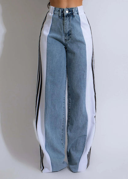 Stylish high-waist denim trousers with patchwork design, available in various color options