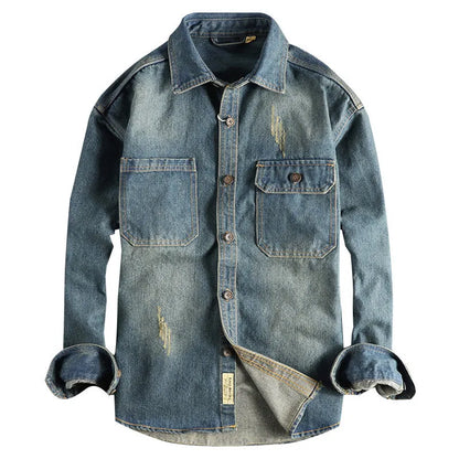 Men's light blue washed vintage denim shirt with long sleeves and a loose cardigan fit.