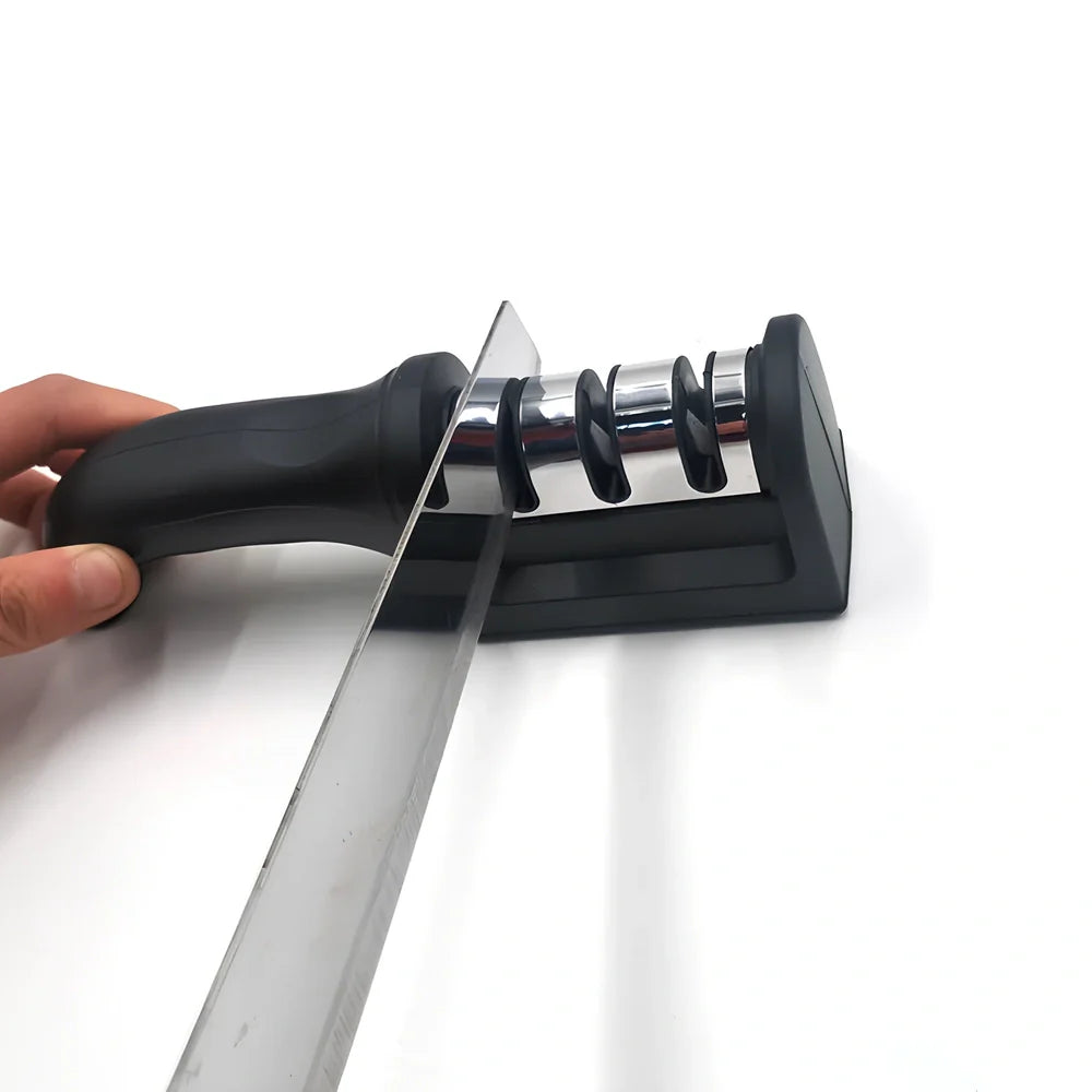 White plastic kitchen knife sharpener measuring 15cm long with special stone sharpening element