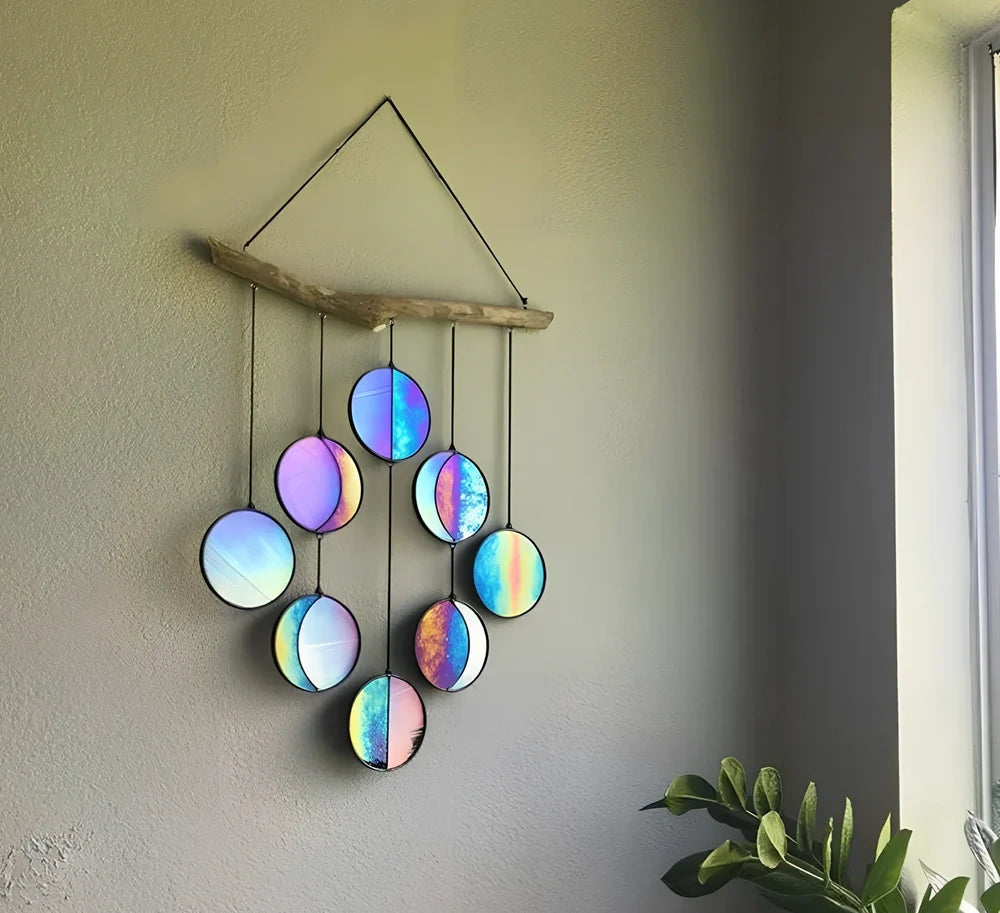 Rainbow coloured moon phase wall decoration with circular iron framework and hanging chain