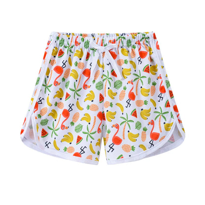 Children's polyester beach shorts in multiple colours and patterns, including leopard print and stripes, shown on size chart.