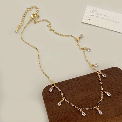 Women's zircon jewellery set showing geometric meteor shower design on necklace, earrings, and anklet