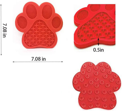 Blue bone-shaped dog licking mat with suction cups on a smooth surface, measuring 18x18cm