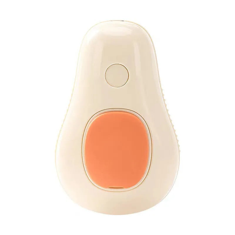 Green avocado-shaped pet grooming spray brush with comb for dogs and cats on a white background.